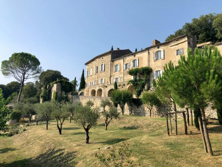 Charming Mediterranean villa surrounded by olive trees and natural landscape.